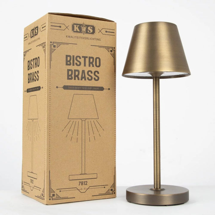 Akku Tischleuchte aus Bronze neben passender Vintage-Kartonverpackung