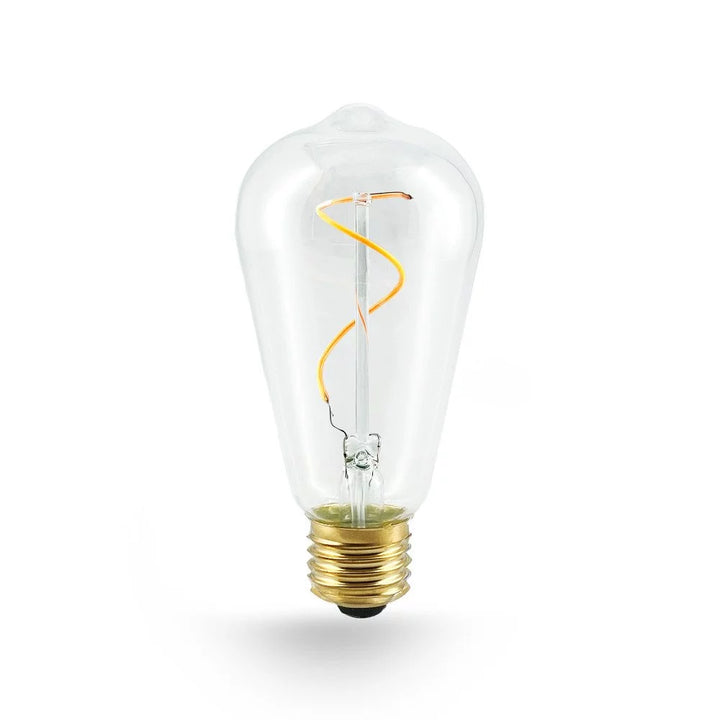 Freigestelltes E27 LED-Leuchtmittel in ST64 Edison-Form mit Klarglas, geschwungenem Spiral-Filament und Messingsockel, unbeleuchtet